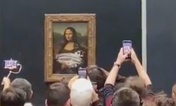 Bir eylemci, Mona Lisa tablosuna kek fırlattı