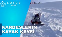 Çin'de iki sevimli kardeşin başarılı kayak performansı büyük ilgi gördü