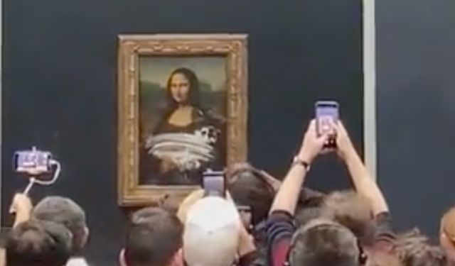 Bir eylemci, Mona Lisa tablosuna kek fırlattı