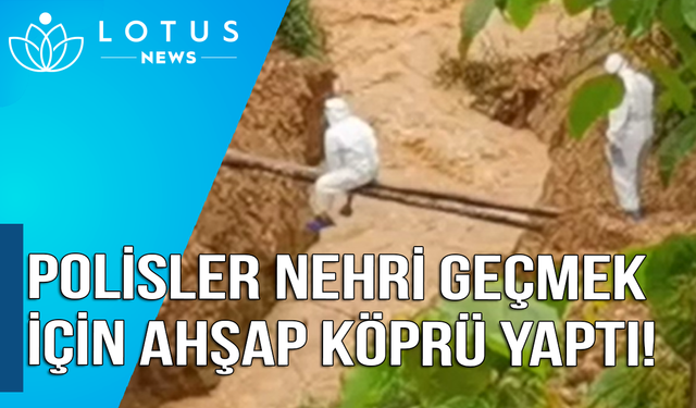 Video: Polisler nehri geçmek için 'ahşap köprü' yaptı